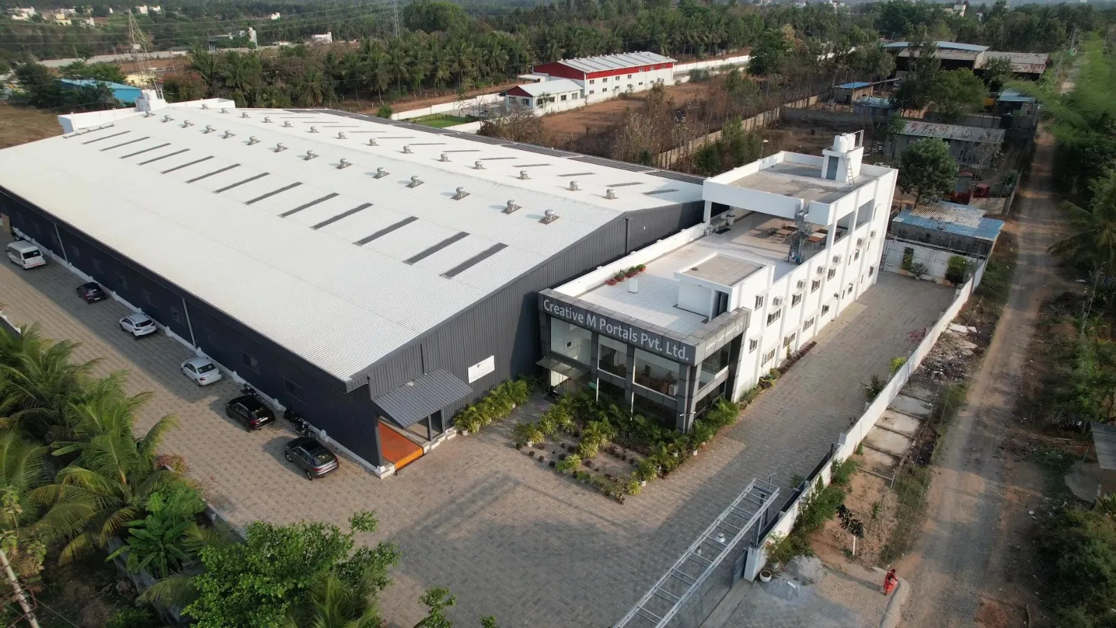 Angled aerial view of the Portals factory building and office block